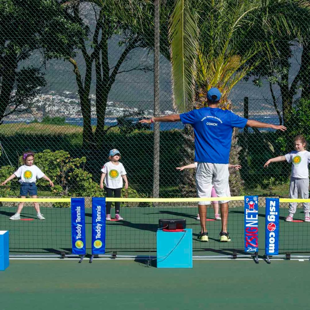Child swinging Teddy Tennis racket
